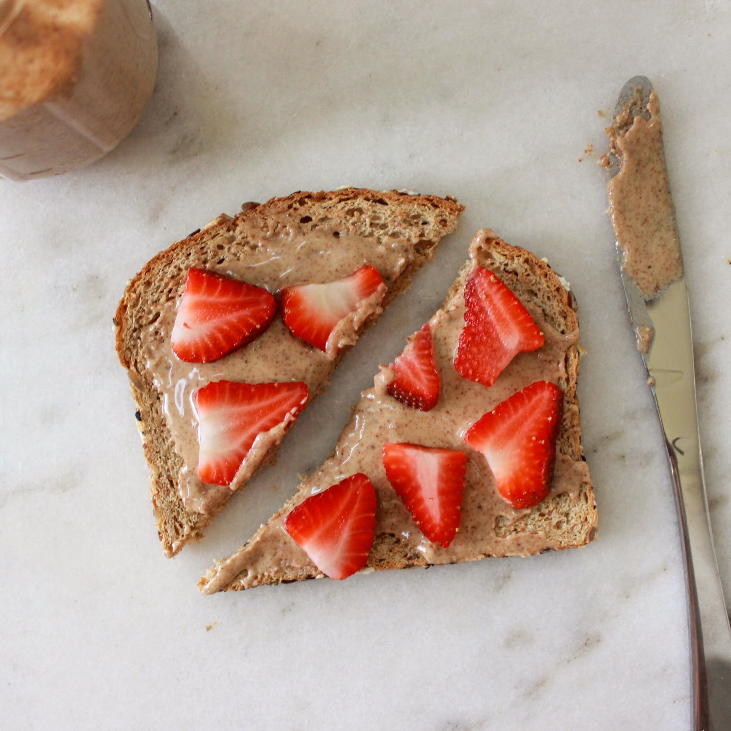 Almond butter on toast with strawberries